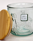 Floral glass jar with a wooden lid and '100% Recycled Glass' label on a white background