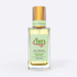A clear glass bottle of Dip Hair & Body Dry Oil, 1.7 fl oz (50 ml), with a gold cap and pastel green label, is shown on a white background. It moisturizes hair and skin beautifully.