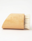 Angular wood shaving brush on white background