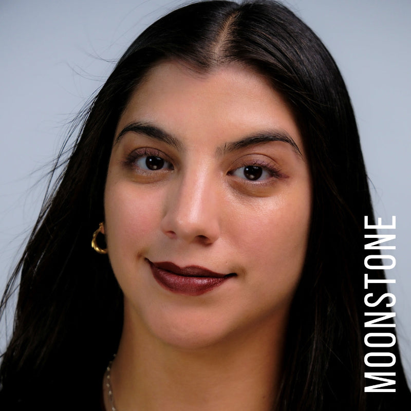 A model wearing the skin tint in the shade Moonstone. 