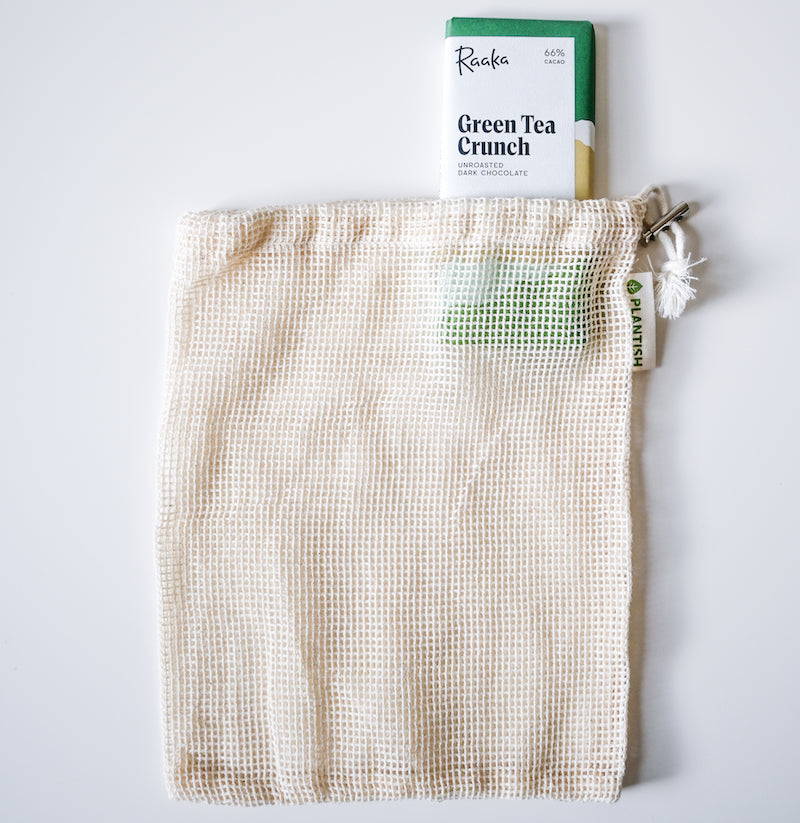 Mesh bag with a green tea crunch product on a white background