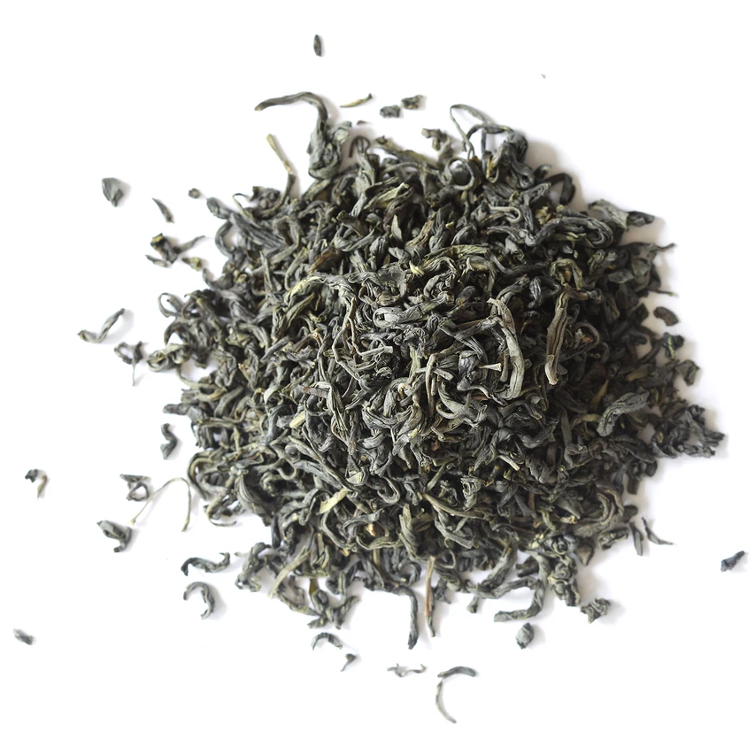 A close up on a pile of loose Spring Green Tea on a white background. 
