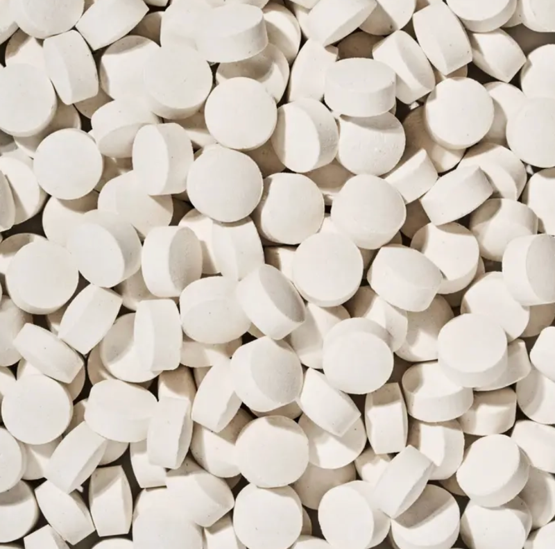 Close-up of a large number of white tooth tabs.