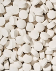 Close-up of a large number of white tooth tabs.