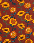 Burnt orange unpaper towel with yellow sunflwers