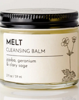 Cleansing balm jar labeled 'MELT' with a black lid on a light background