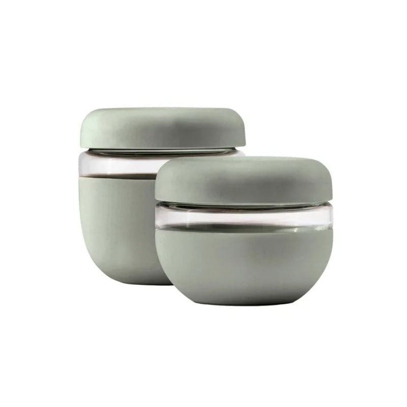 The  2 sage green glass seal-tight bowls  in the 2 cup and 3 cup sizes sitting together on a white backdrop. 