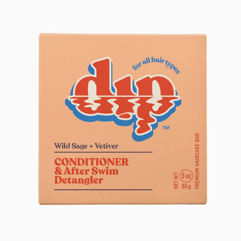 orange  box of Dip conditioner bar for all hair types scented wild sage vetiver on white backdrop. 