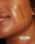 Medium dark skinned woman featuring medium foundation swatched on cheek