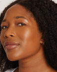 Medium dark skinned woman featuring medium dark foundation 