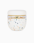 Terrazzo glass and silicone jar with white lid on white background