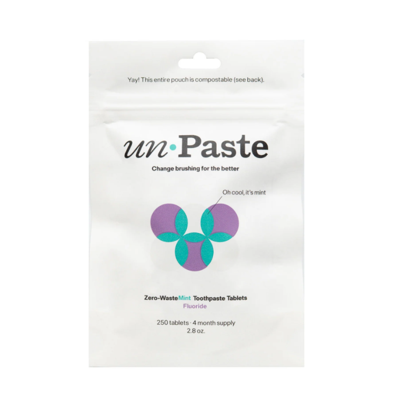 Package of unPaste zero-waste mint toothpaste tablets on a white background