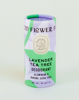 purple and green paper tube of lavender tea tree deodorant on white background 