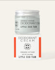 Deodorant cream jar with packaging labeled 'Orange Vetiver' by Little Seed Farm on a white background