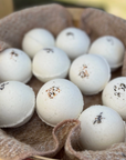 brown basket of white bath bombs