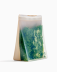 tan and clear silicone bag with herbs inside