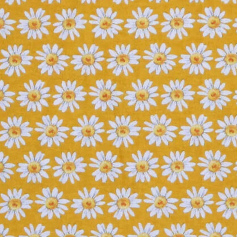 Pattern of white daisies with yellow centers on a mustard yellow background