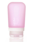 A medium 2.5 oz silicone bottle in the color pink on a white surface. 