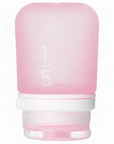 A small 1.7 oz silicone bottle in the color pink on a white surface. 
