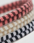 close up image of woven hair ties