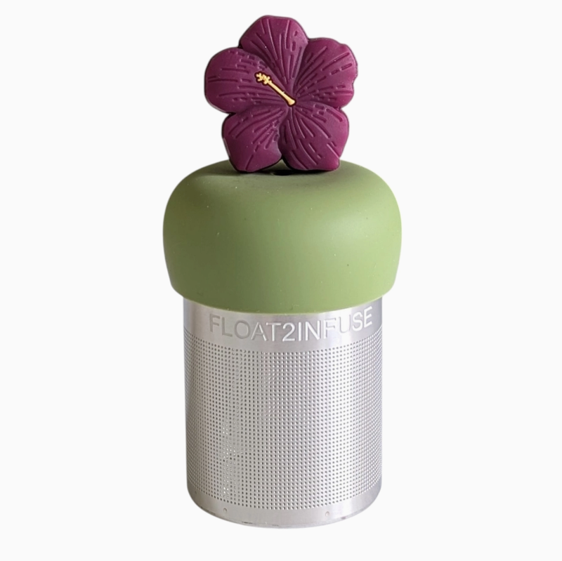 Tea infuser with a purple flower on top against a white background