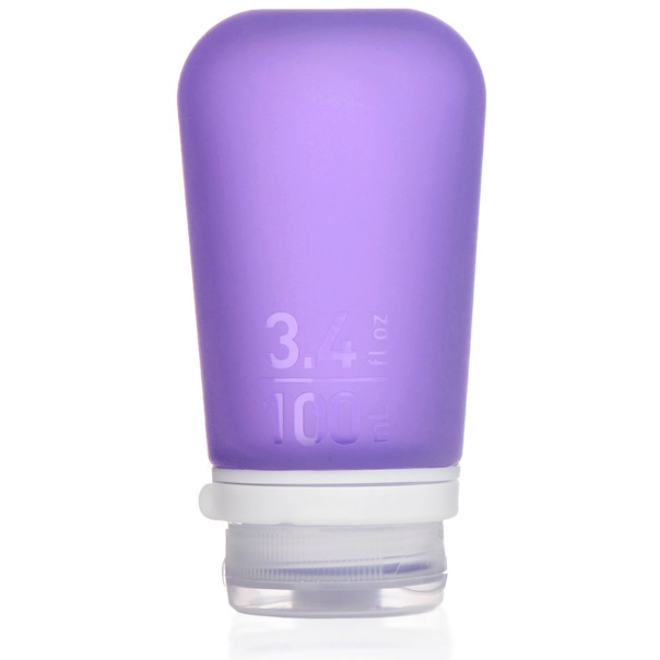 A large 3.4 oz silicone bottle in the color purple on a white surface. 
