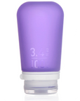 A large 3.4 oz silicone bottle in the color purple on a white surface. 