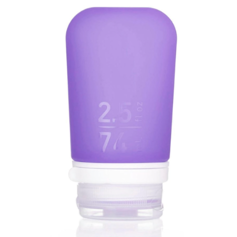 A medium 2.5 oz silicone bottle in the color purple on a white surface. 
