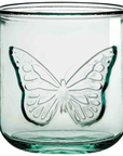Clear glass candle holder with butterfly design on a white background