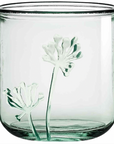 green glass jar with flower 