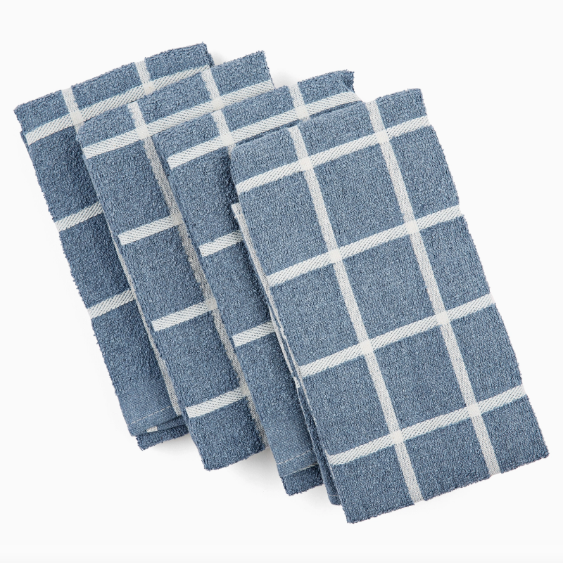 Set of four blue checkered towels on a white background
