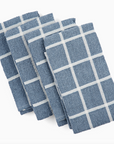 Set of four blue checkered towels on a white background