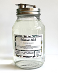 Glass jar labeled 'Rinse Aid' on a white background