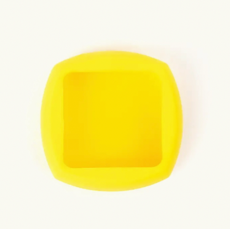 A bright yellow square-shaped silicone mold with rounded corners, shown from a top-down view on a clean white background.