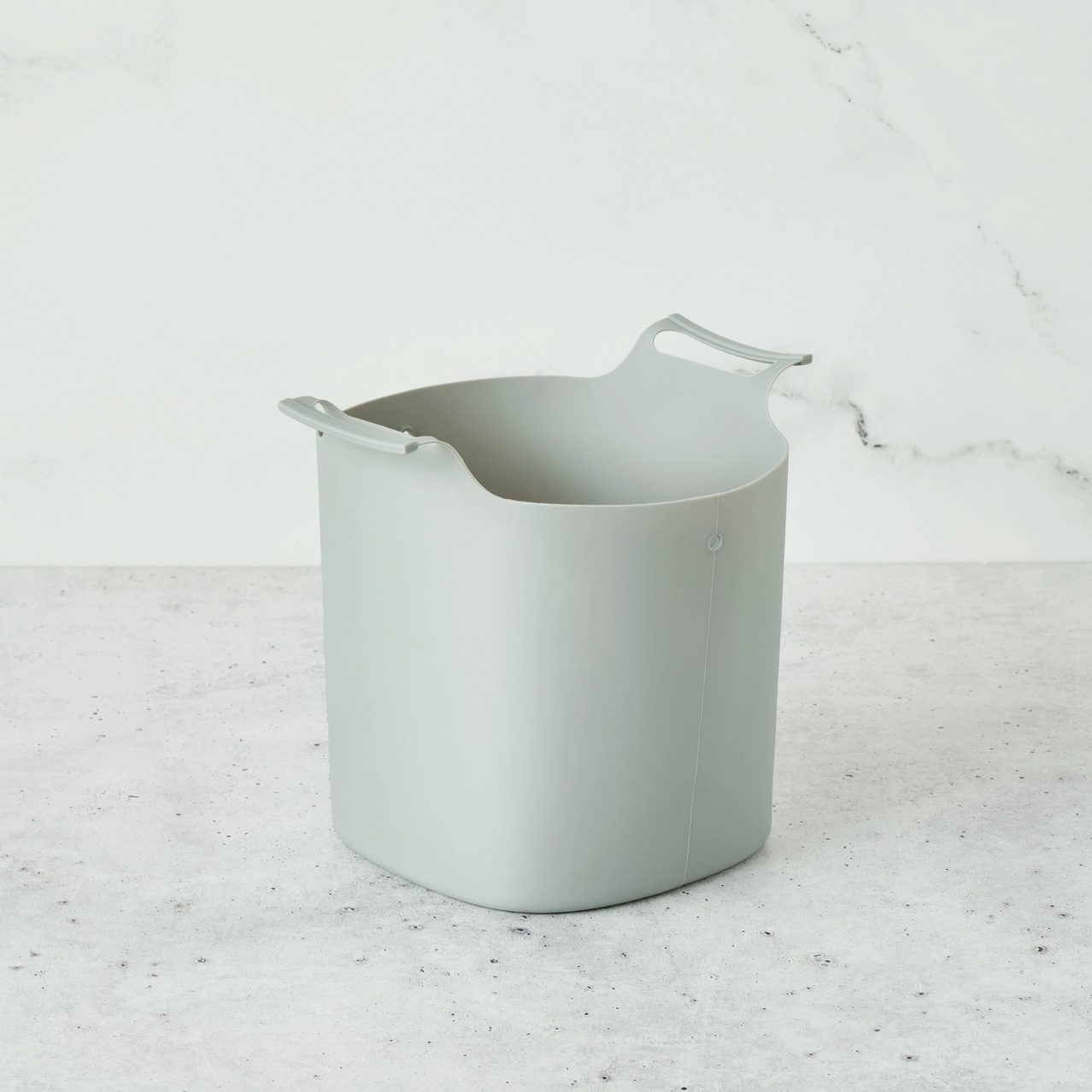 grey bin on marble background