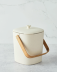 white bin with wooden handle for compost on marble background 