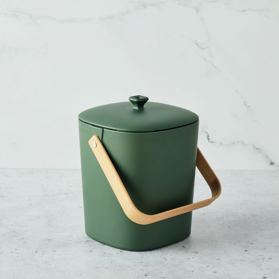 forest green bin with lid on marble backgrop