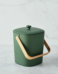 forest green bin with lid on marble backgrop