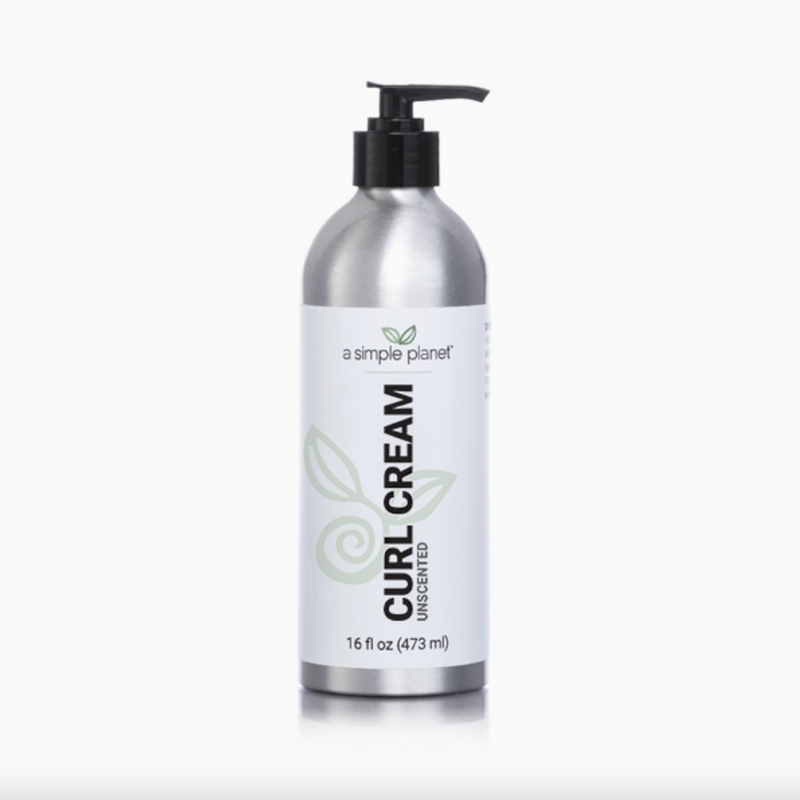 A Simple Planet Curl Cream, 16 fl oz (473 ml), in a silver pump bottle with a minimalist leaf design, is unscented and made with organic flaxseed for beautifully defined curls on a crisp white background.