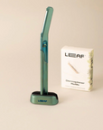 green metal face shaver in stand 
