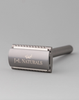 Gray safety razor with 'J&L Naturals' branding on a light gray background