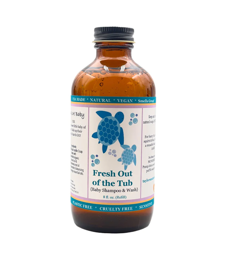 A brown bottle labeled Taylors Naturals Baby Shampoo & Body Wash, 8 fl oz (Refill), features blue turtle graphics and highlights its natural, vegan, cruelty-free, and eco-friendly formula.