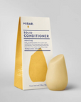 Box of yellow solid conditioner bar on white background. Soothe bar. 